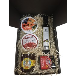Cesta pequeña con pimentón, aceite, miel, jamón curado y lata aceite, ajo y tomate para empresas